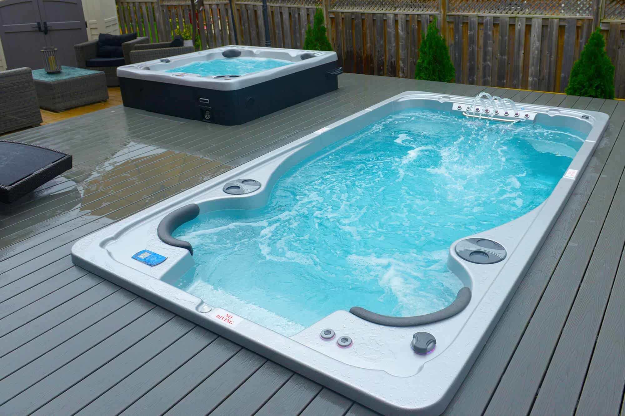 small swim spas - swim spa and hot tub installed on a deck 