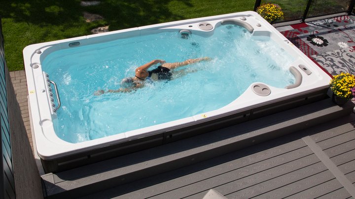 Small swim spas - woman swimming in a Hydropool swim spa